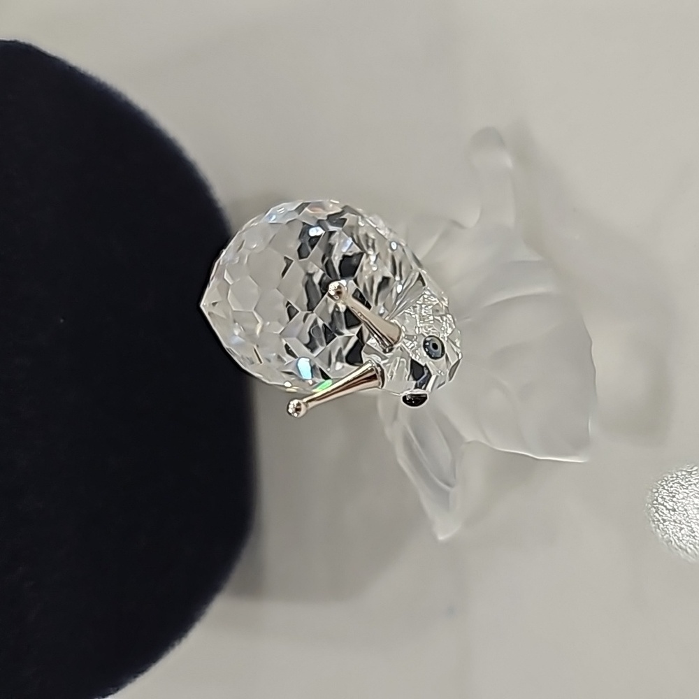 Swarovski snail on a vine leaf